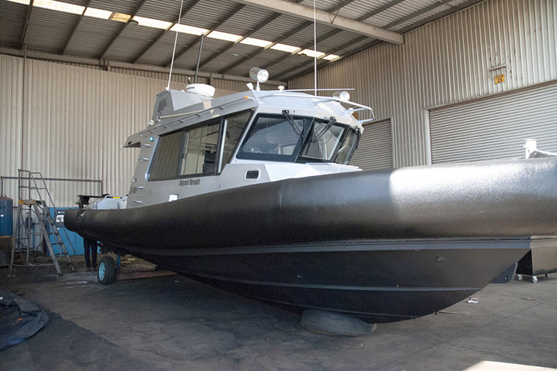 Protective coating on boat hull at Kelmscott LINE-X.